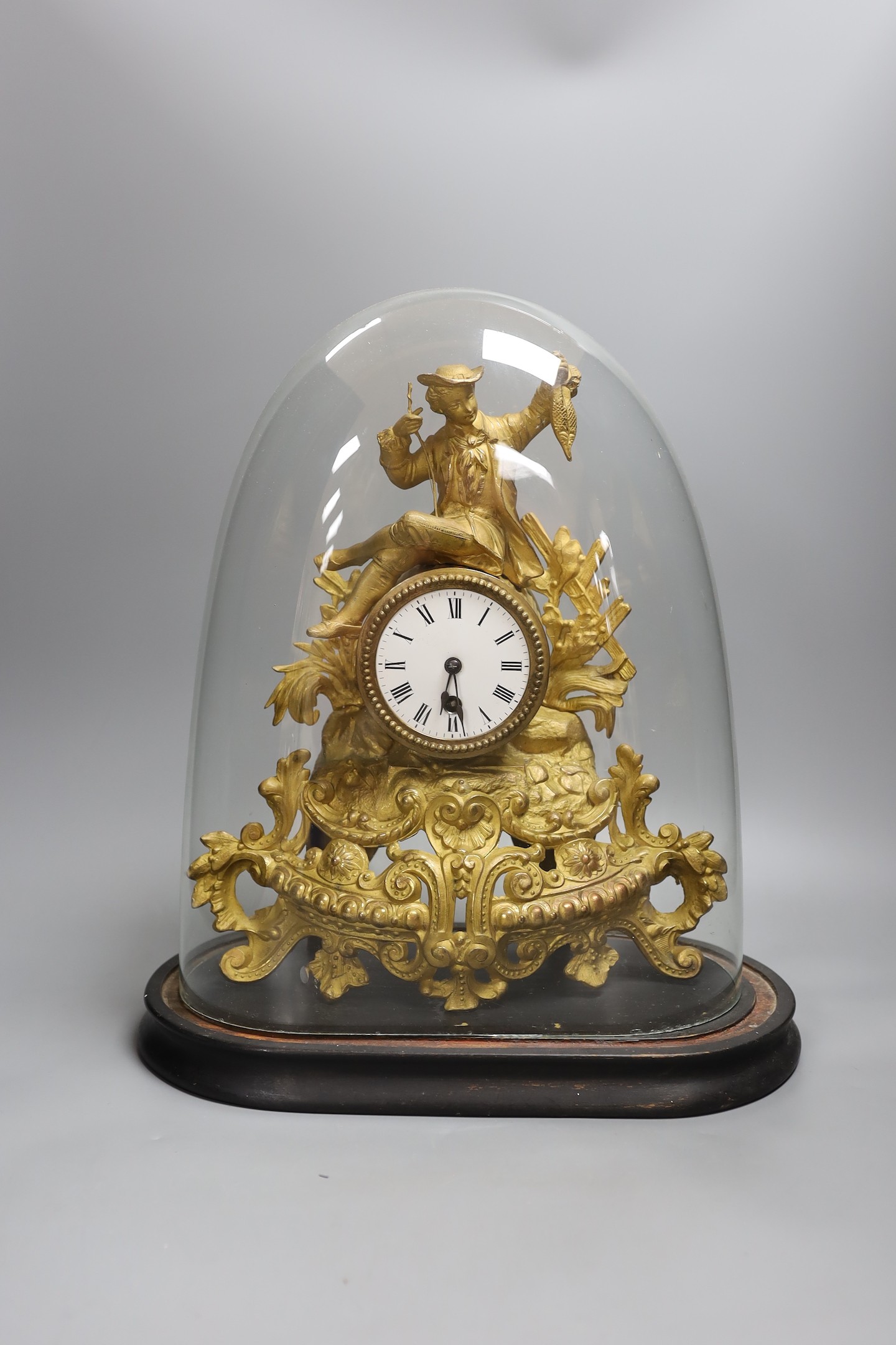 A Victorian gilt spelter mantel clock, under dome, 40 cms high